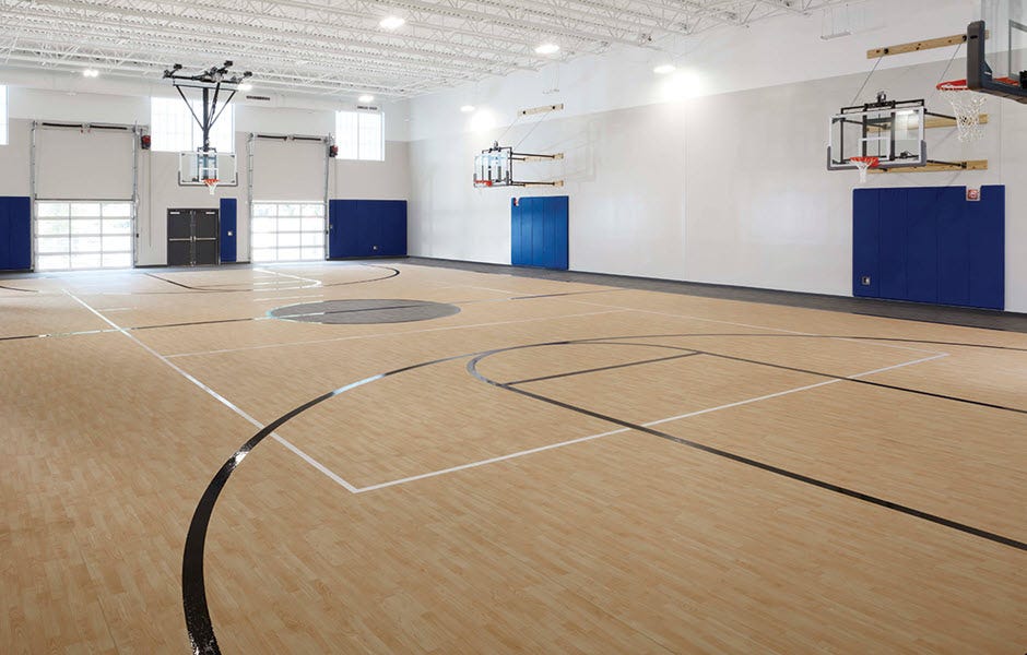 Woodflex™—realistic wood looks. Gameflex®—vibrant, fun colorways. Image of Woodflex as part of a basketball court.
